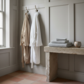Two robes on panelled wall
